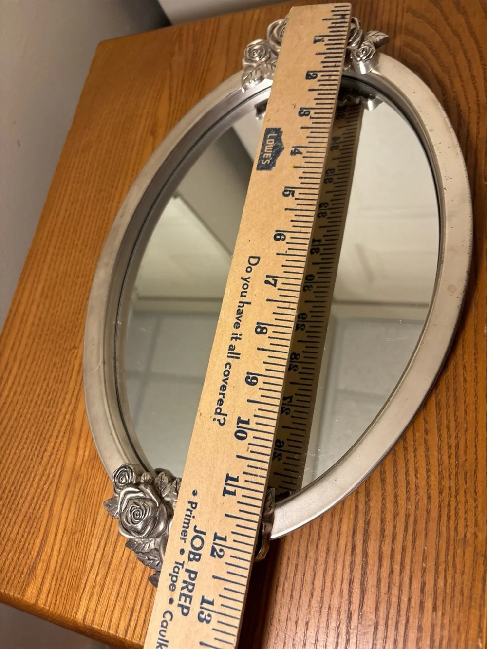 Elegant Silver Oval Wall Mirror with Rose Accents